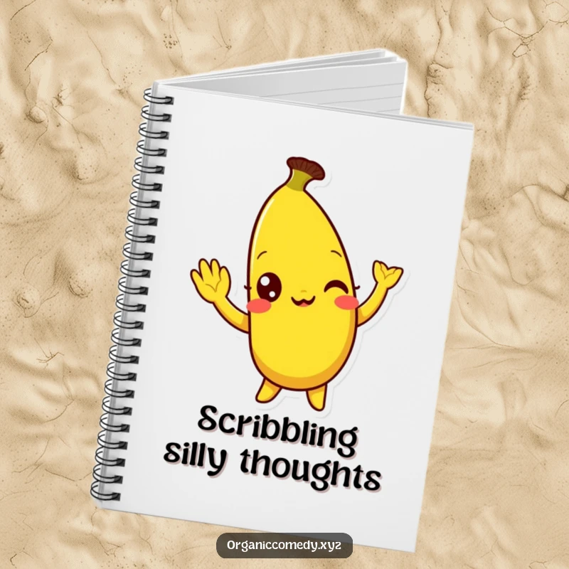 Funny, bright yellow banana character with eyes wide with mirth doing a silly wave, decorating the cover of a practical notebook.